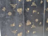 a black and gold screen with gold designs on it