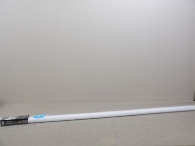une brosse à dents posée par terre à côté d'un porte-brosse à dents