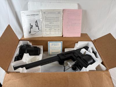 a box with a gun and other items in it