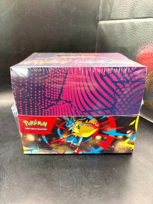 a close up of a box of pokemon cards on a table