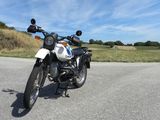 a motorcycle that is parked on the side of the road