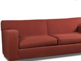 an image of a red couch sitting on top of a white floor