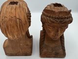 pair of carved wood busts of a woman and a man