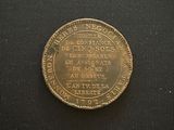 a close up of a coin on a black surface