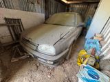 a dirty car that is parked in a garage