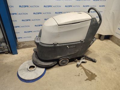 une image représentant une autolaveuse posée sur le sol