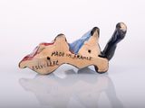 figurine made in france of a man lying on his back