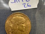 a close up of a gold coin with a label on it
