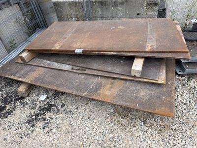 several pieces of wood are stacked on top of each other in a pile