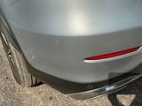 a close up of a car ' s rear end with a sticker on it