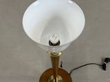 a lamp that is sitting on a table next to a cord