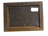 an old wooden picture frame with a hole in the middle of it