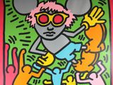 graffiti painting of a mouse with sunglasses and a cat on a skateboard
