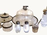 a lot of glass items that are sitting on a table