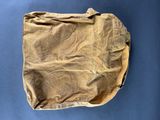 an old brown bag on a blue surface