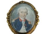 une vieille photo d'un homme en costume bleu et cravate rouge