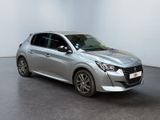 the silver car is parked in a white room with a black floor