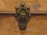 a close up of a suitcase with a latch on it