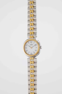 a close up of a woman ' s wrist watch on a white background