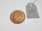 a close up of a coin with a price tag on it