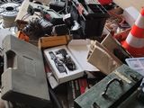 a pile of junk on a table in a garage