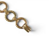 an image of a gold bracelet on a white background