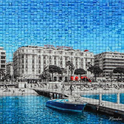 a painting of a boat in the water next to a building