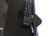 a remote control sitting on top of a black box
