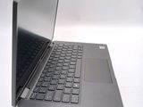 a black laptop with a black keyboard on a white surface