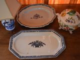 two plates and a bowl sitting on a table