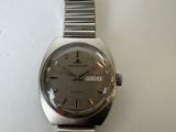 an image of a wrist watch sitting on a white surface