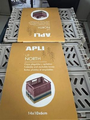 two boxes of food sitting on top of each other