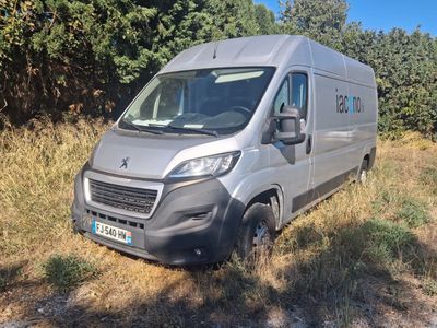 the van is parked on the side of the road in the grass