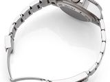 a close up of a watch on a white surface with a white background
