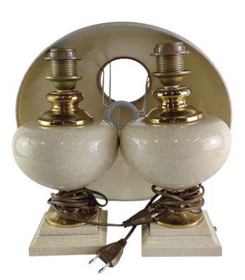 pair of white and gold table lamps on marble bases