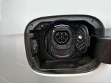 a close up of a car ' s fuel tank with a plugged in