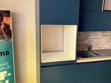 a kitchen with blue cabinets and a sink in it