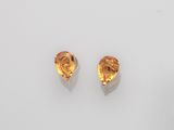 a pair of citrine quartz earrings on a white surface