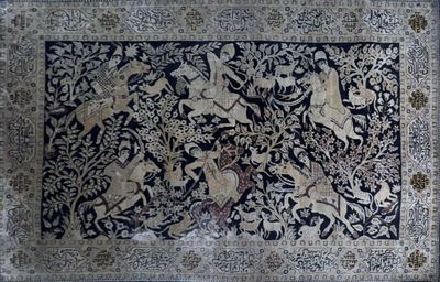 an antique persian rug with a black and white design on it