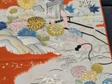 a long table runner with flowers and birds on it