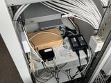 a white chair that has a bunch of wires in it