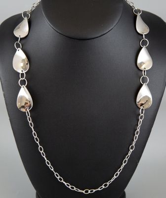 a close up of a necklace on a mannequin mannequin
