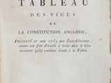 an old book with writing on it sitting on a table