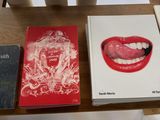 three books sitting on a table next to each other