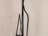 a metal sculpture that is standing on a table
