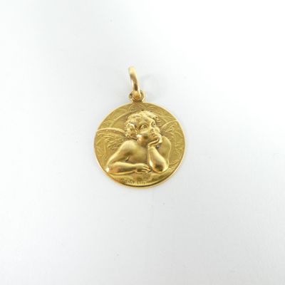 an image of a gold coin with a small angel on it