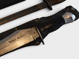 two knives that are sitting next to each other on a table