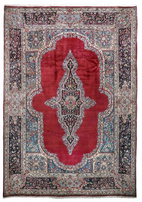 un tapis rouge et bleu à motifs de médaillons