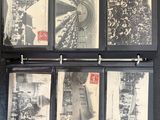 an old black and white photo of a bunch of old postcards