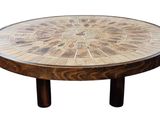 a wooden table with a circular design on top of it